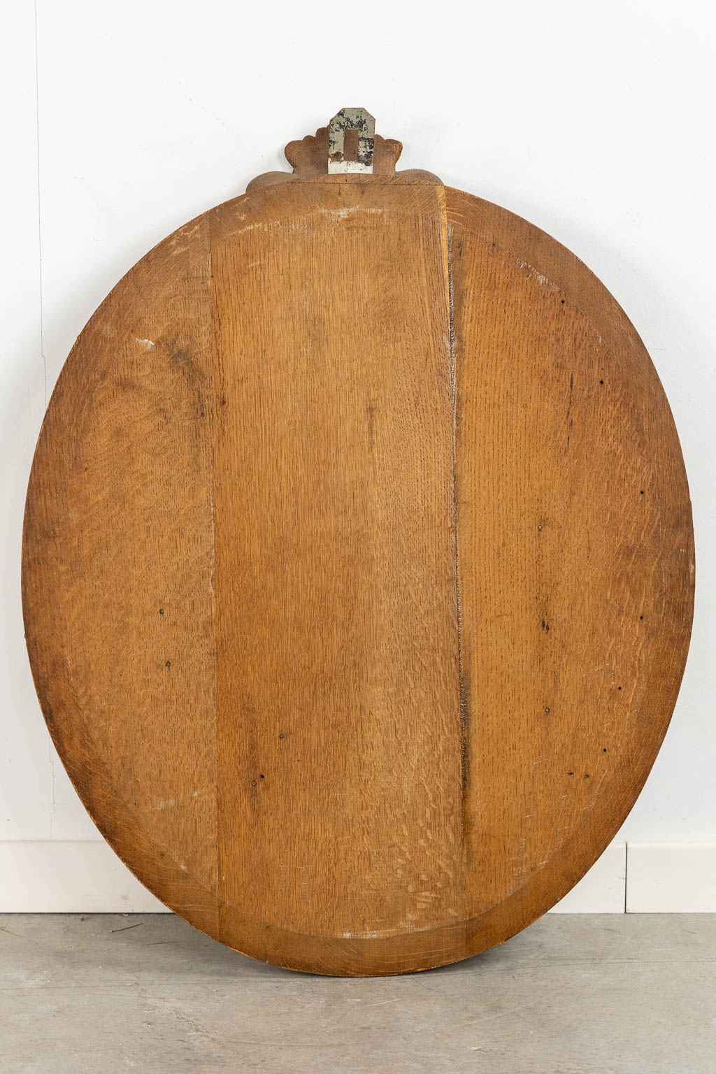 A set of four big oval wood sculptures depicitng 