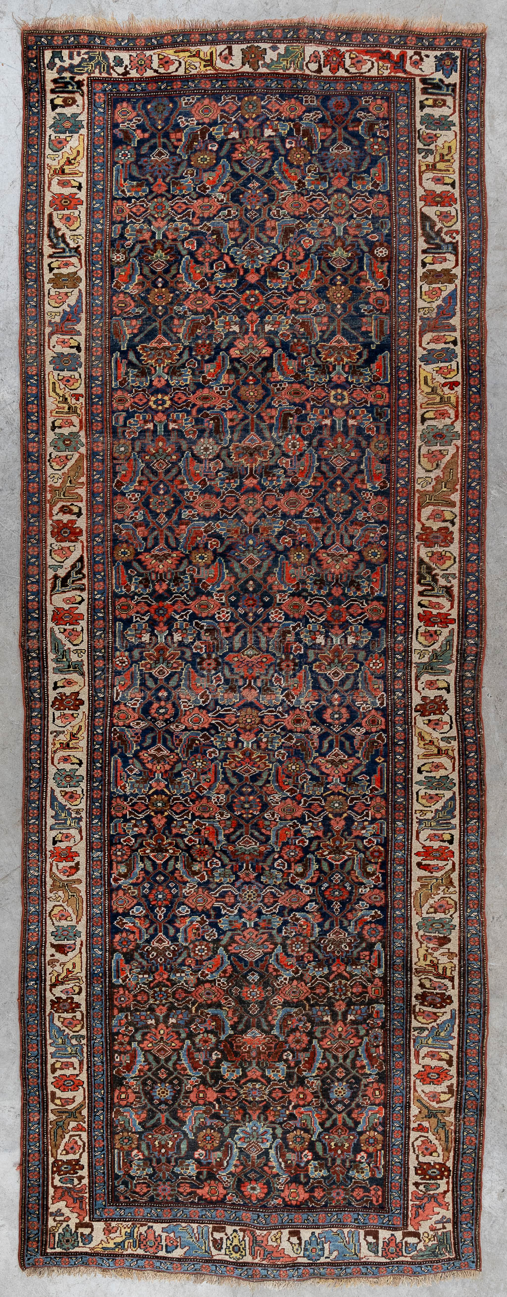 A Persian hand-made runner with floral decor. (L:120 x W:319 cm)