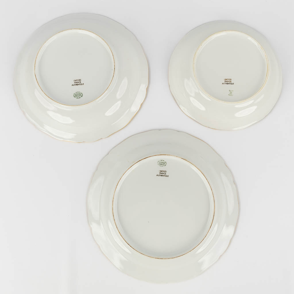 ULIM Limoges, a large dinner and coffee service, porcelain with a gilt rim. (L:26 x W:31 x H:20 cm)