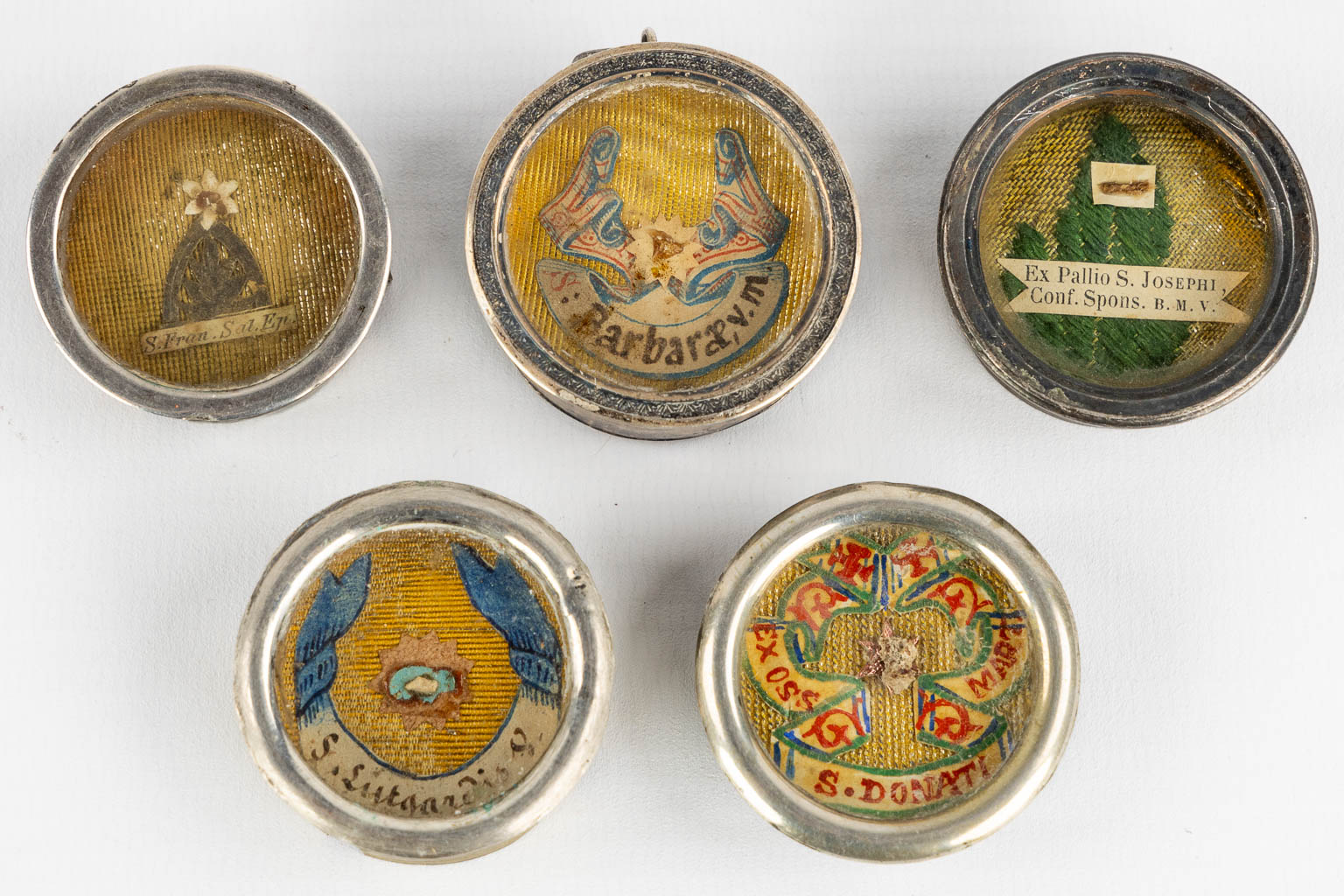 Five sealed theca with relics for saints. 