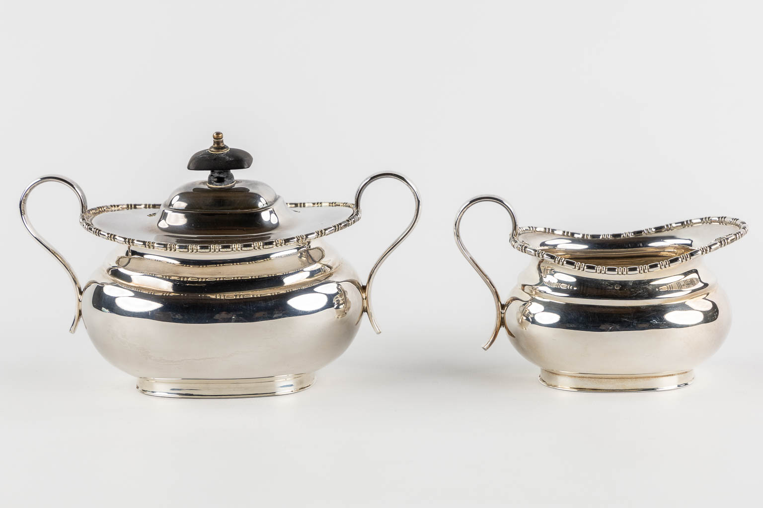 A 5-piece coffee and tea service, Silver-Plated, Sheffield UK. (L:38 x W:59 cm)