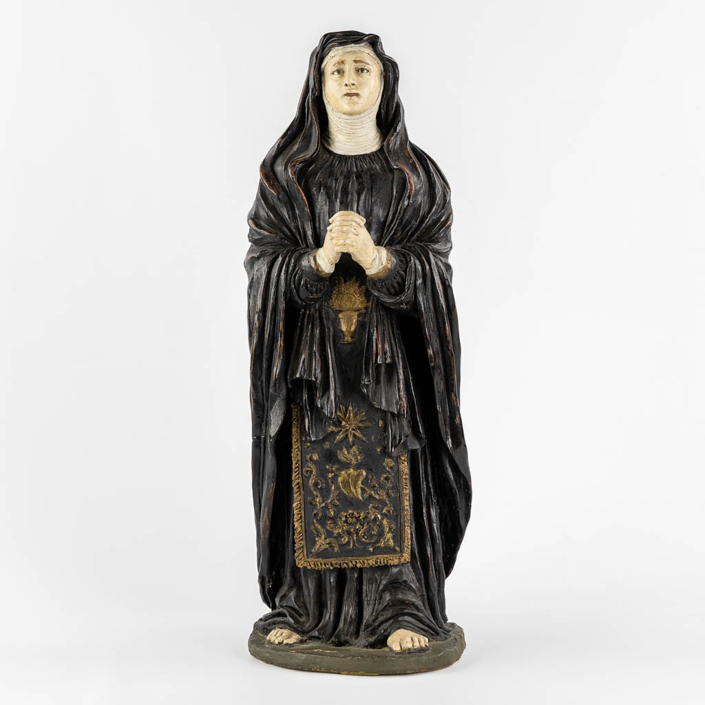 Saint Genoveva of Paris, polychrome terracotta with glass eyes. (W:17 x H:54 cm)