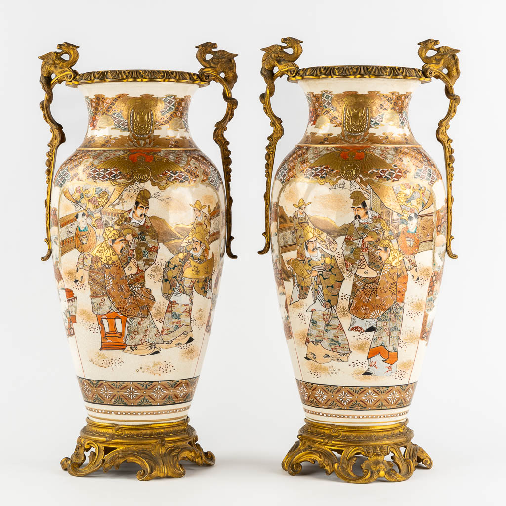 A pair of Japanese Kutani vases, mounted with bronze. Added a Chinese Canton vase. (L:24 x W:27 x H:56 cm)