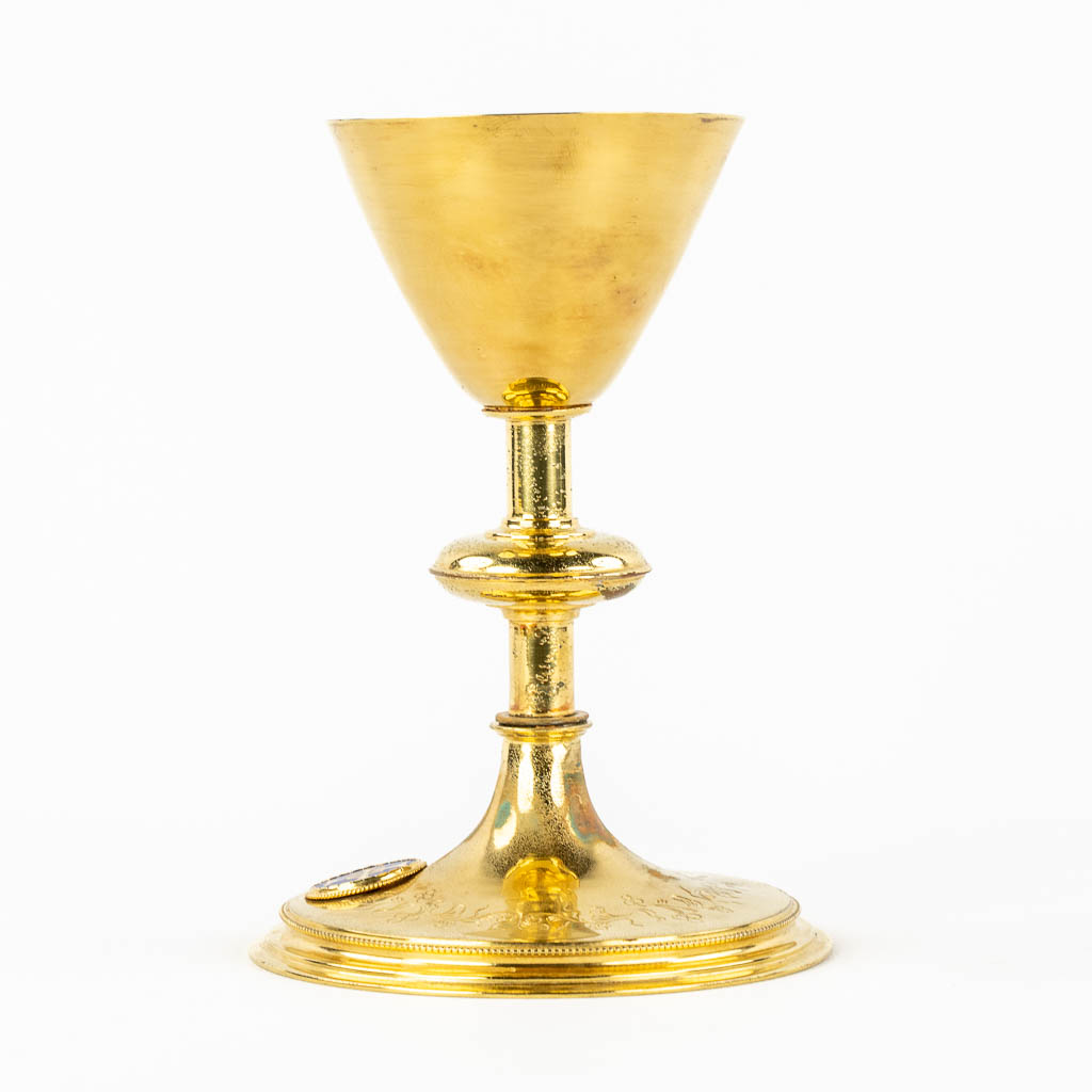 A Gothic Revival Chalice, gold-plated brass with an enamel plaque. 19th C.