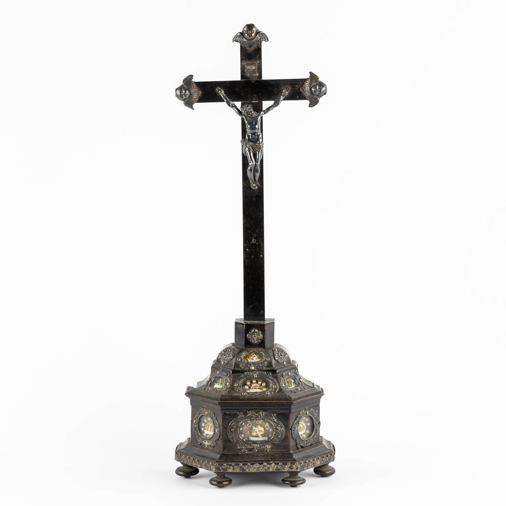 An ebonised wood Reliquary crucifix, 7 relics, mounted with silver. 19th C. (W:17 x H:50 cm)