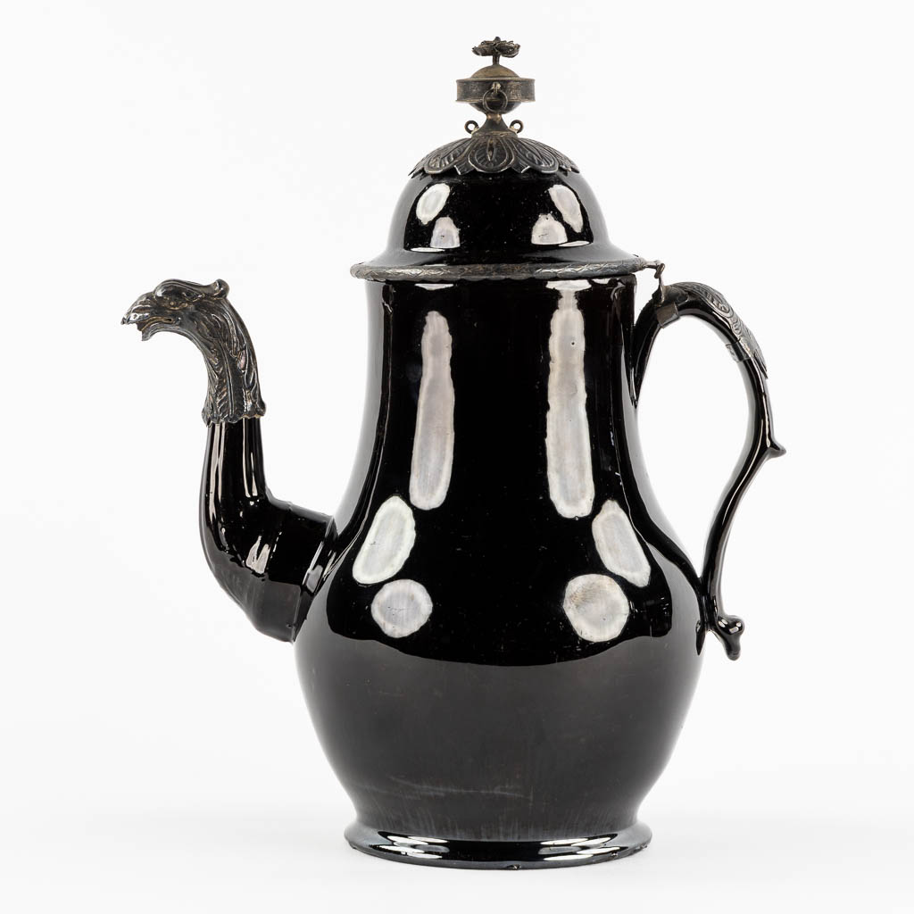 A coffe pot, glazed stoneware mounted with silver. Namur, Belgium, 18th C. (L:16 x W:24 x H:30 cm)