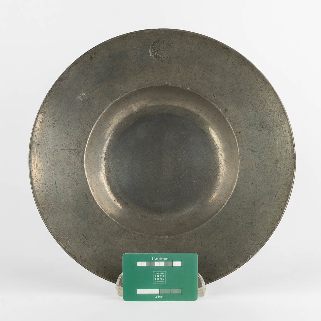 A Tin/Peweter plate in the shape of a Cardinal hat, Southern France, Circa 1625-1650. (D:31 cm)