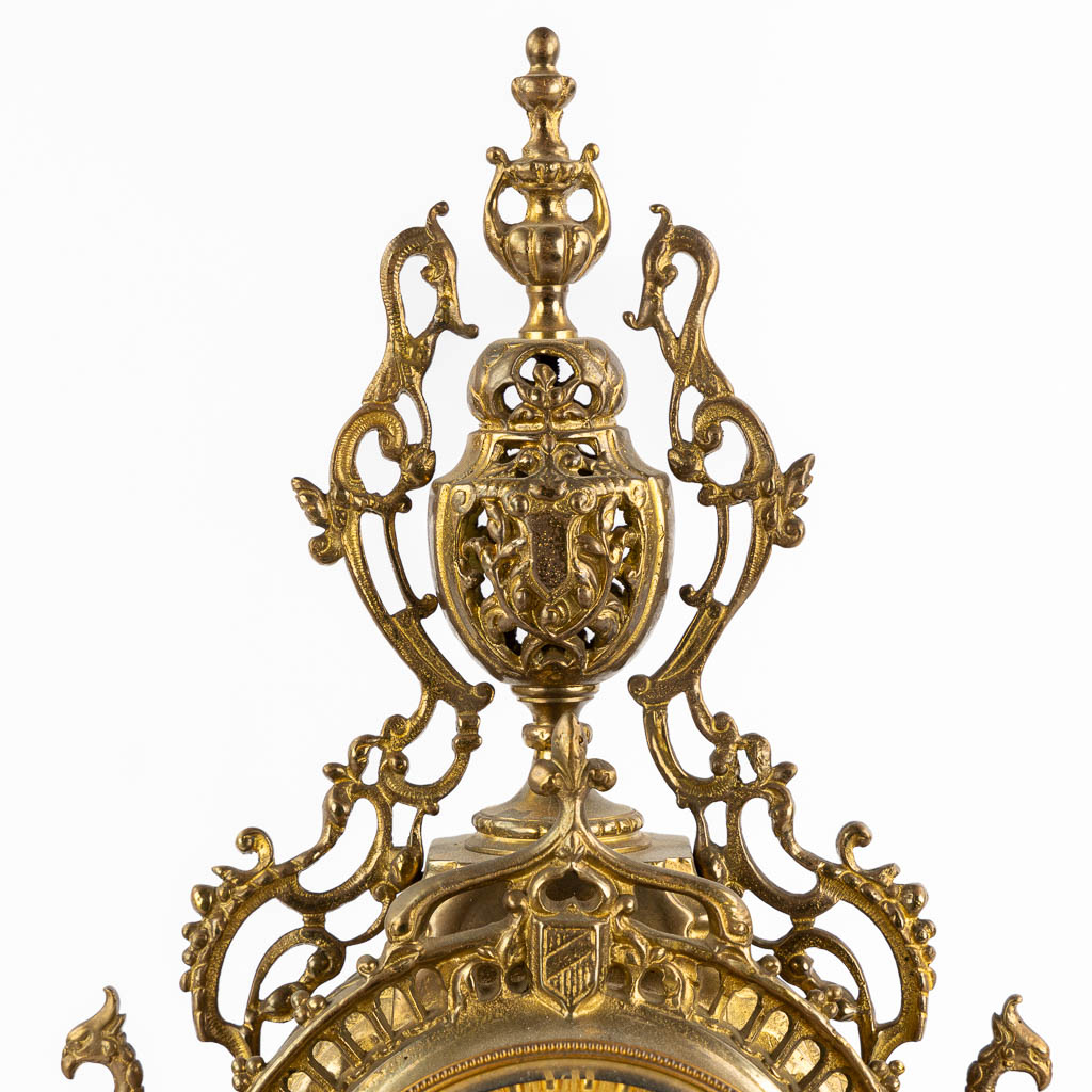 A three-piece mantle garniture clock and candelabra, bronze. 20th C. (L:12 x W:28 x H:51 cm)