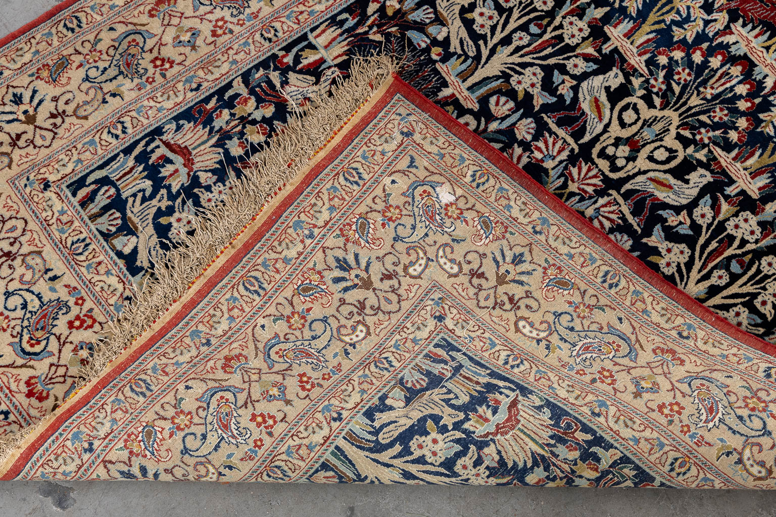 An Oriental hand-made carpet, birds and trees, Isphahan/Isfahan. (L:181 x W:107 cm)