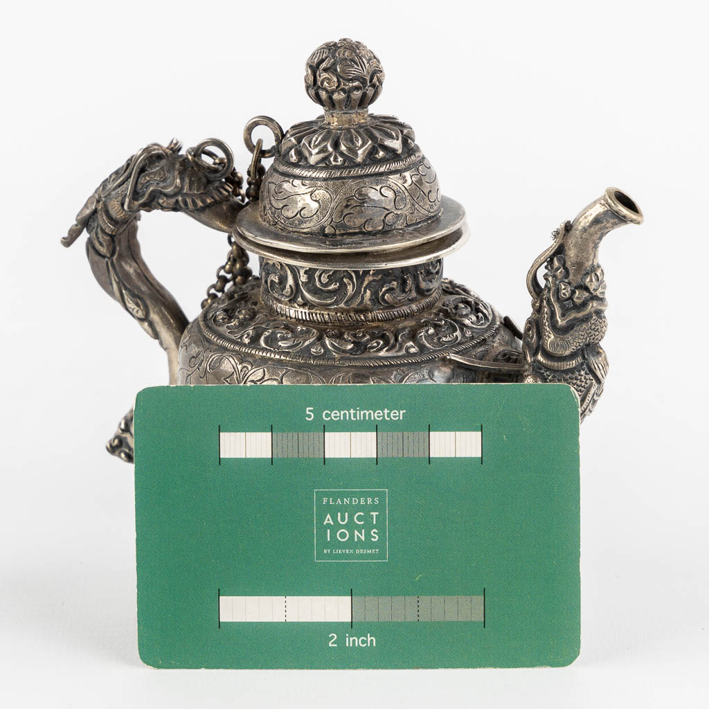 A small silver and Ceremonial teapot, Probably Tibet. (L:7 x W:12 x H:11,5 cm)