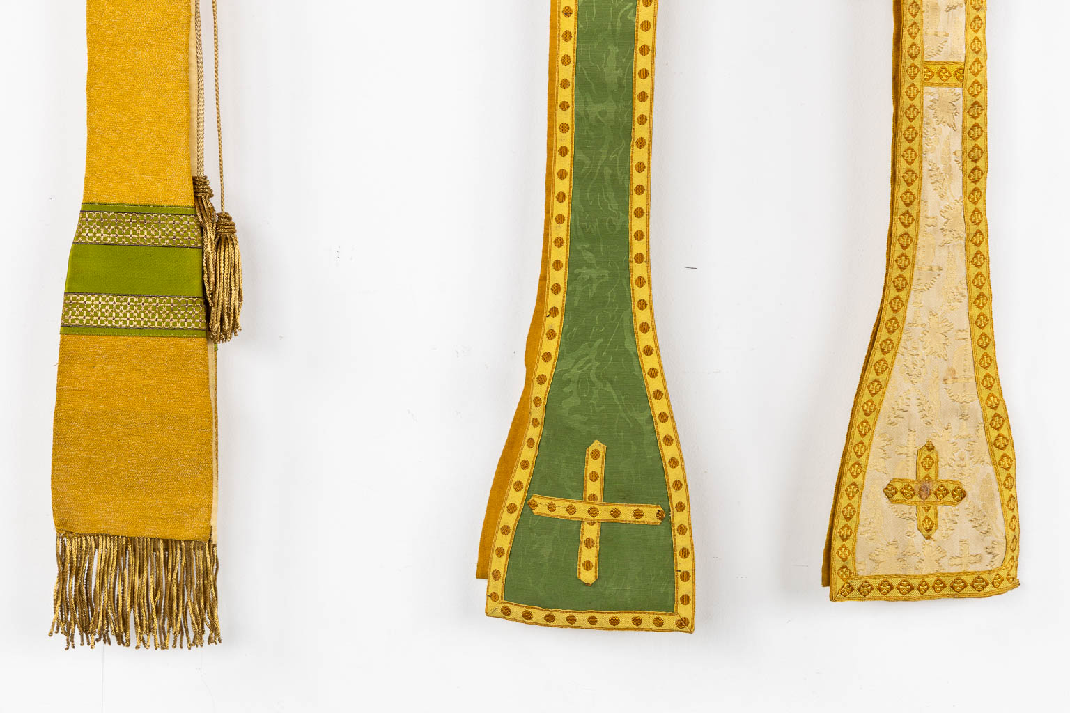 Two Dalmatics and a Roman Chasuble, added are a big collection of stola and maniple. 