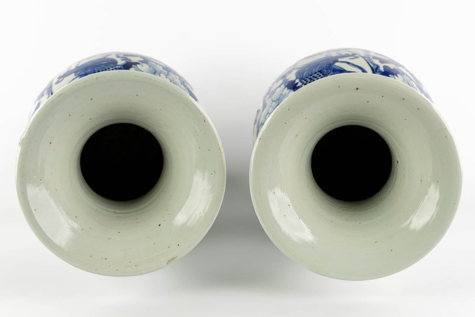 A pair of Chinese vases, blue-white decor of flowers and birds and a fish. (H:57 x D:22 cm)