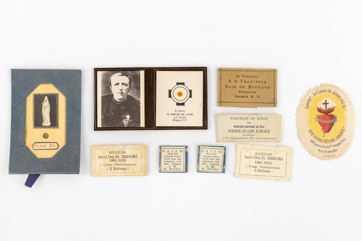 A collection of relics and religiosa, Paaschnagel, sealed paper relics and Agnus Dei. 