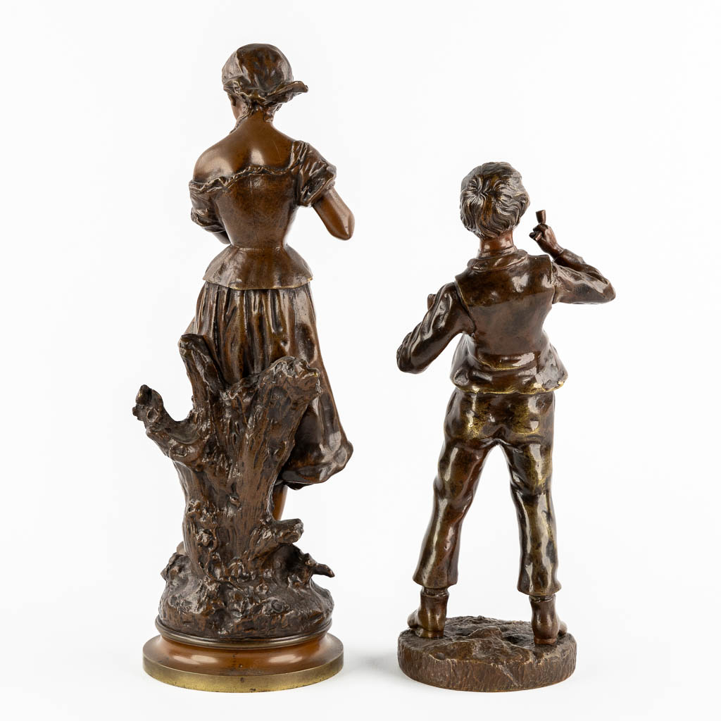 Twee gepatineerde bronzen figuren van een Dame en Roker, circa 1900.