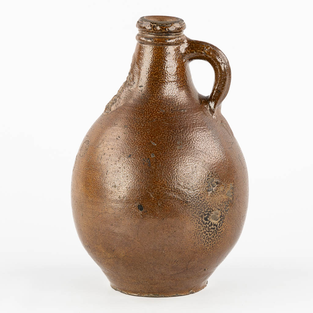 An antique Bartmann jug with three stamps, 17th C. (H:27 x D:17 cm)