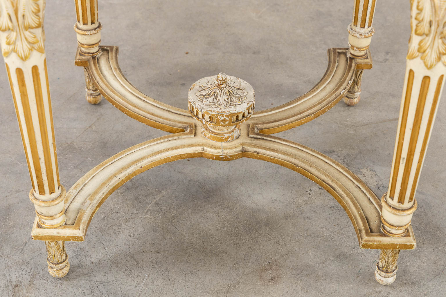 A wood-sculptured and patinated table with a grey marble, Louis XVI style. (L:65 x W:112 x H:80 cm)