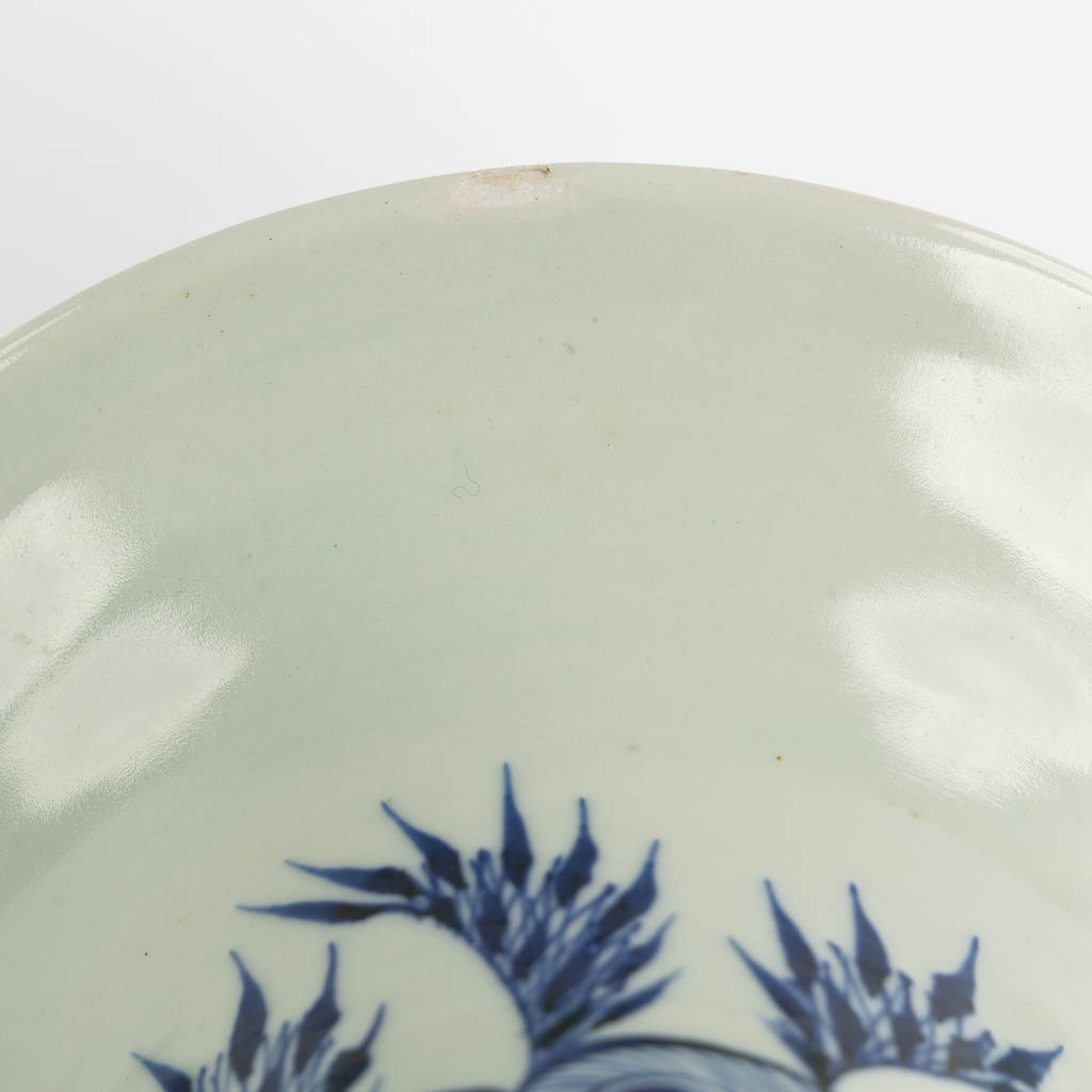 A pair of Chinese vases, blue-white decor of flowers and birds and a fish. (H:57 x D:22 cm)