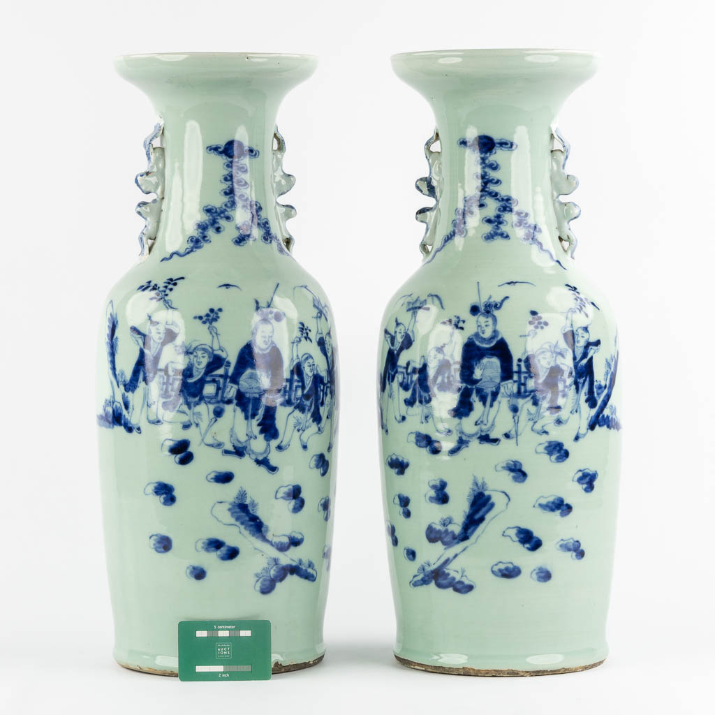 A pair of Chinese vases with a blue-white decor of playing children. (H:57,5 x D:21 cm)