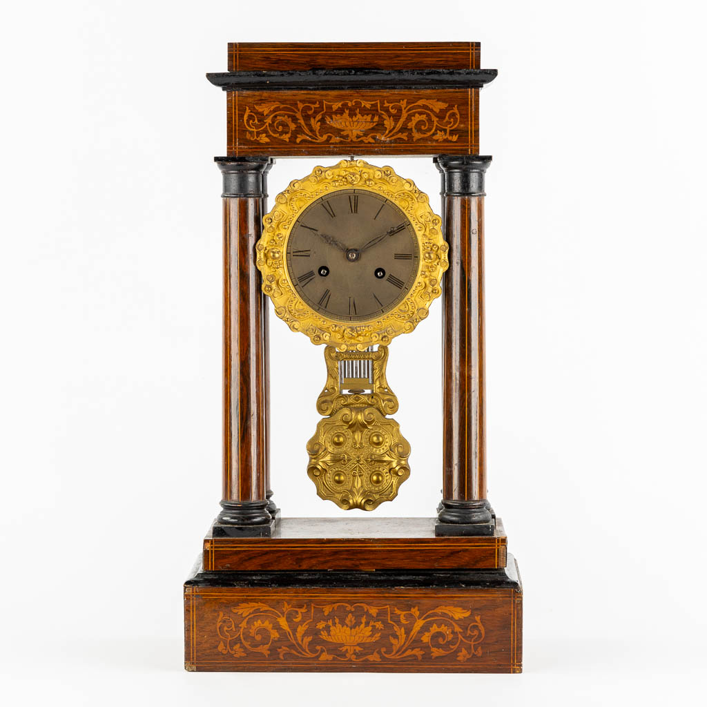 A column clock, marquetry inlay and gilt bronze. 19th C. (L:15 x W:25 x H:46 cm)