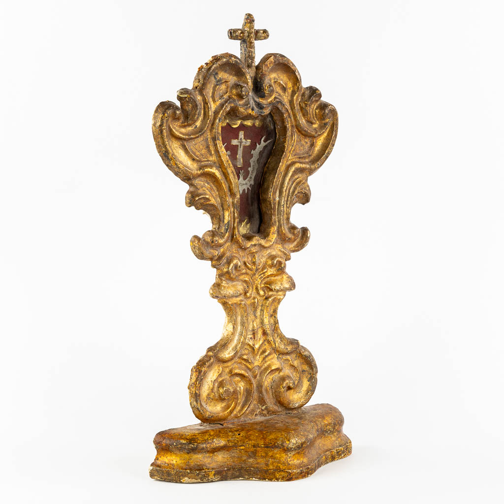 An antique wood-sculptured reliquary holder with a sealed relic of the true cross, Baroque, 18th C.