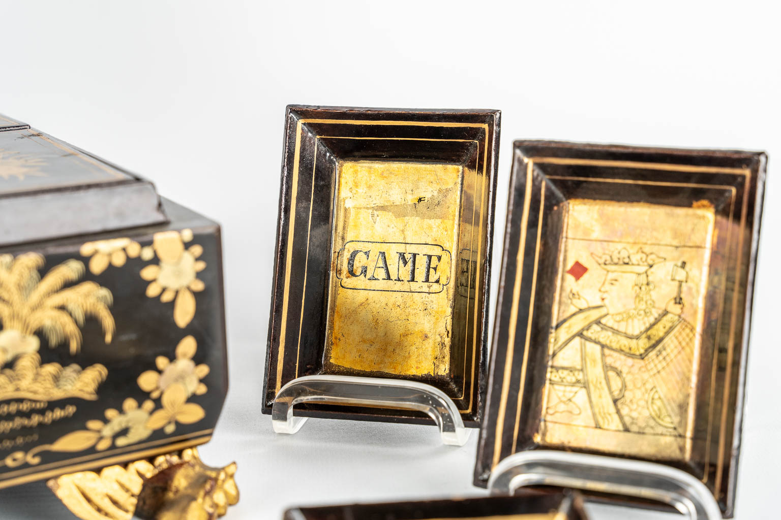 A Chinese Canton export game box, lacquered with hand-painted decors. 