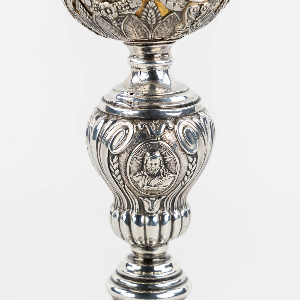 A silver chalice with a vemeil cuppa, rich decor in Baroque style. 19th C. (H:26 x D:14 cm)