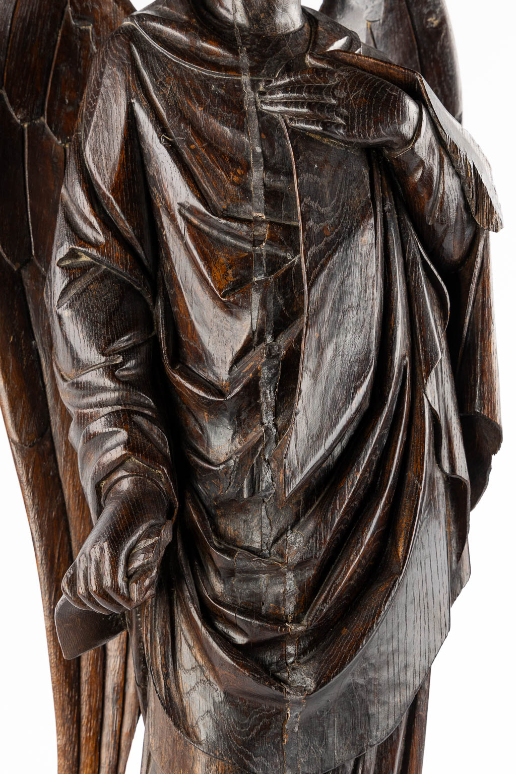 A large wood sculptured figurine of an angel, oak, 19th C. (L:20 x W:40 x H:95 cm)