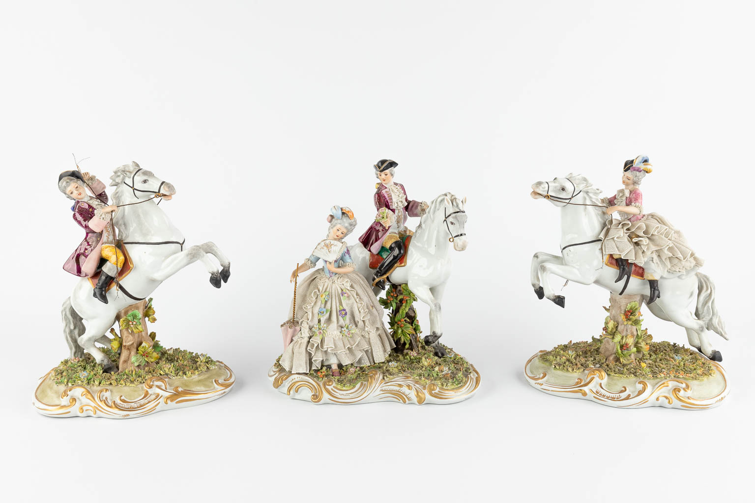 Capodimonte, three groups with horses, 20th C. (W:22 x H:26 cm)