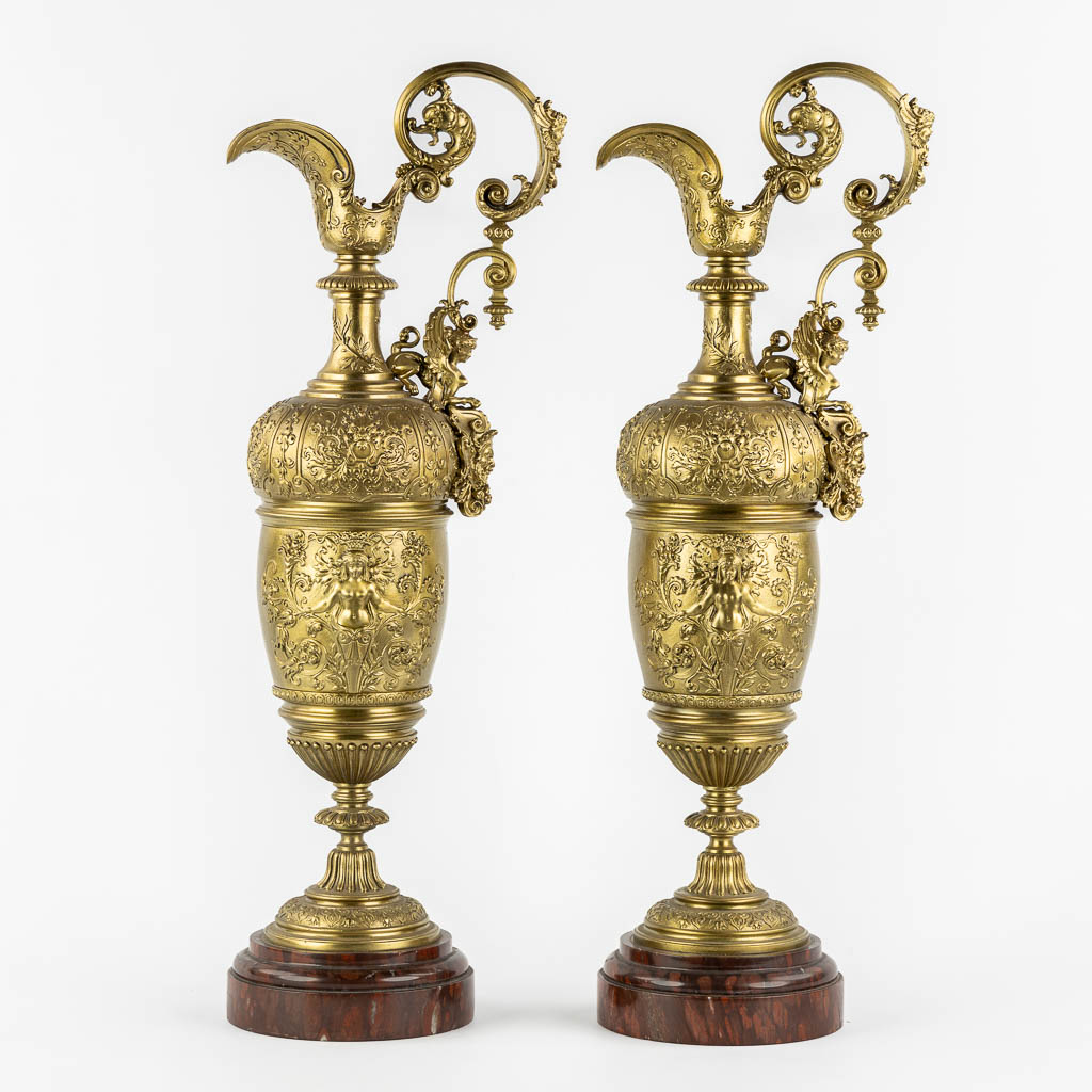 A large pair of pitchers, in the style of Ferdinand Barbedienne. 19th C. (L:15 x W:21 x H:59 cm)