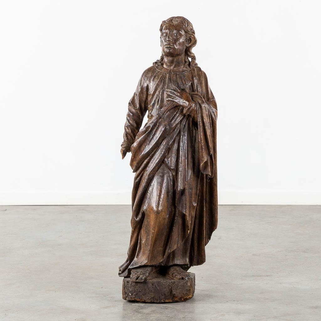 Flemish school, a wood-sculptured figurine of Saint John. 15th C. (L:26 x W:37 x H:105 cm)