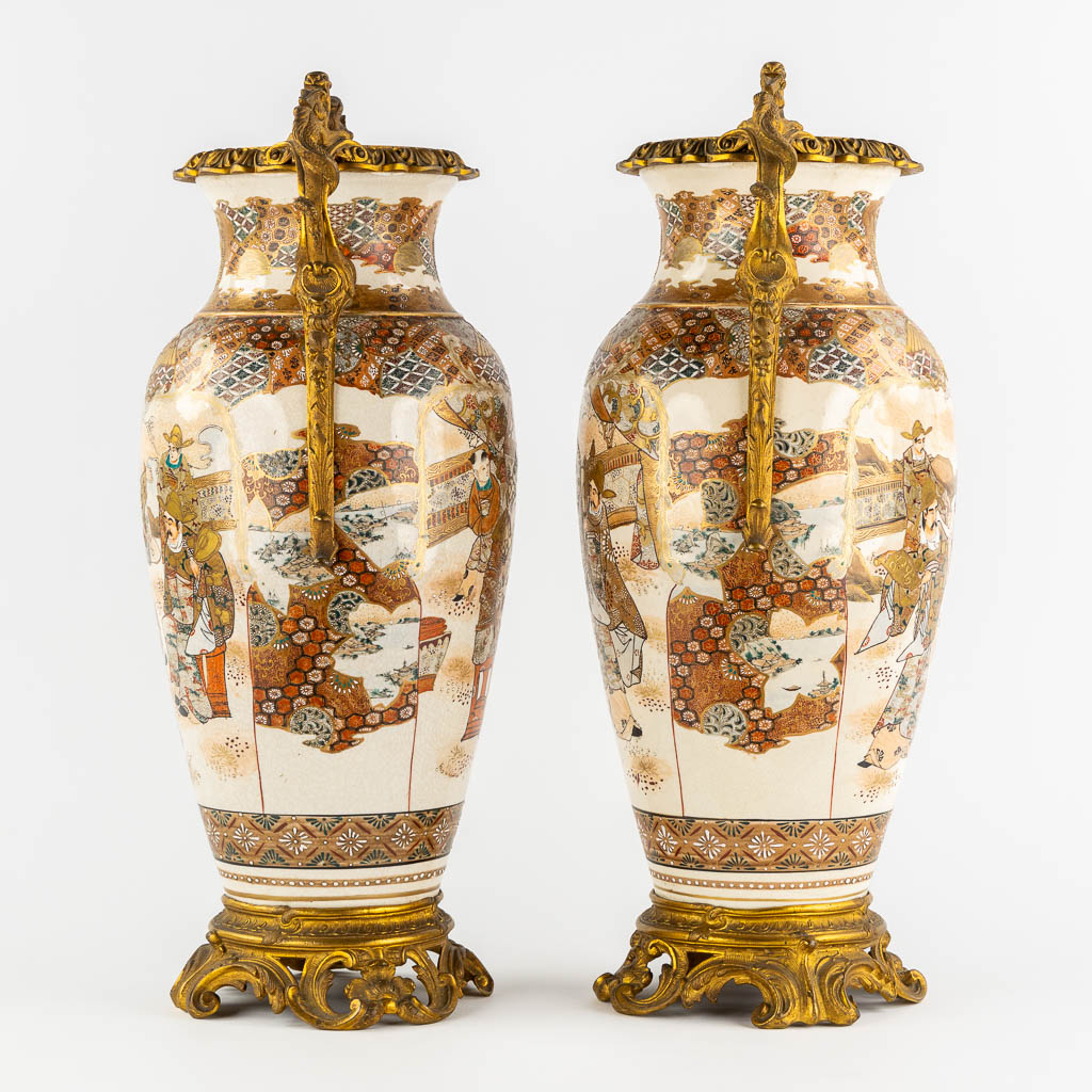 A pair of Japanese Kutani vases, mounted with bronze. Added a Chinese Canton vase. (L:24 x W:27 x H:56 cm)