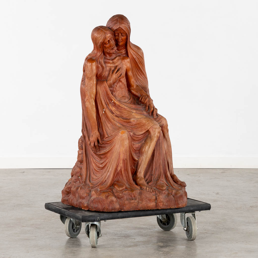 A large, red patinated terracotta Piëta.