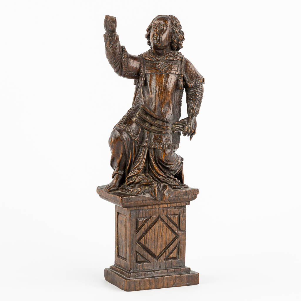 An antique wood-sculptured figurine of a saint holding a scourge. 17th C. (W:10 x H:29 cm)