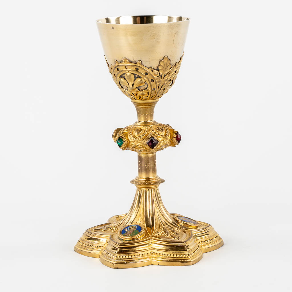 A Gothic Revival chalice with enamel plaques, cabochons. Silver Cuppa, Gilt brass, 19th C.