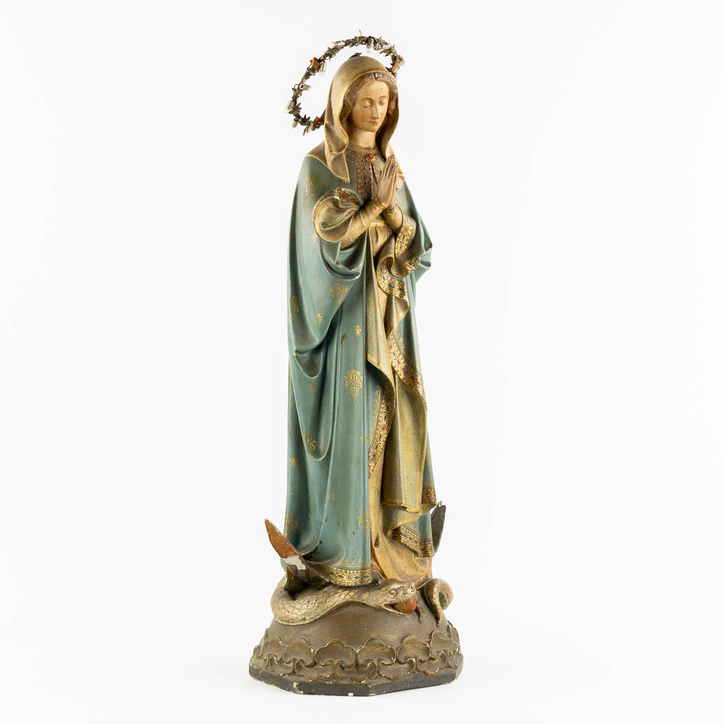 A Gothic Revival Virgin Mary on Crescent moon trampling the serpent, Polychrome plaster. Circa 1900. (H:81 cm)