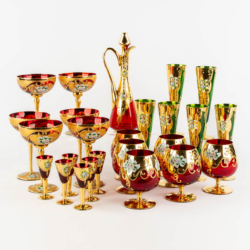 A carafe and 24 glasses, Venetian glass. (H:39,5 cm)