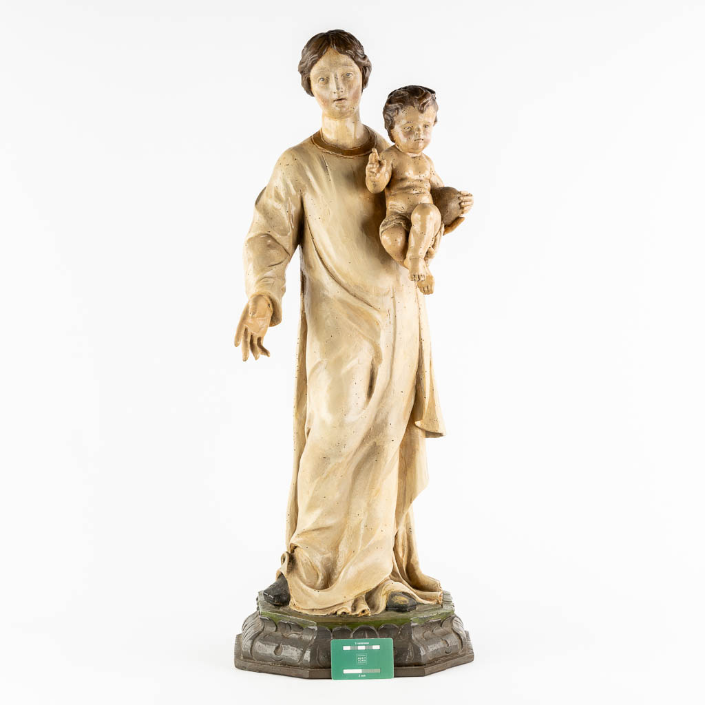 A wood-sculptured and patinated figurine of Madonna with a child. 18th C. (L:33 x W:34 x H:90 cm)