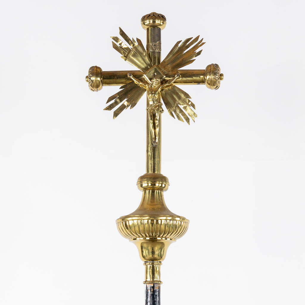 Four Processional crucifixes with their stands. Silver-plated metal and Brass. (H:265 cm)