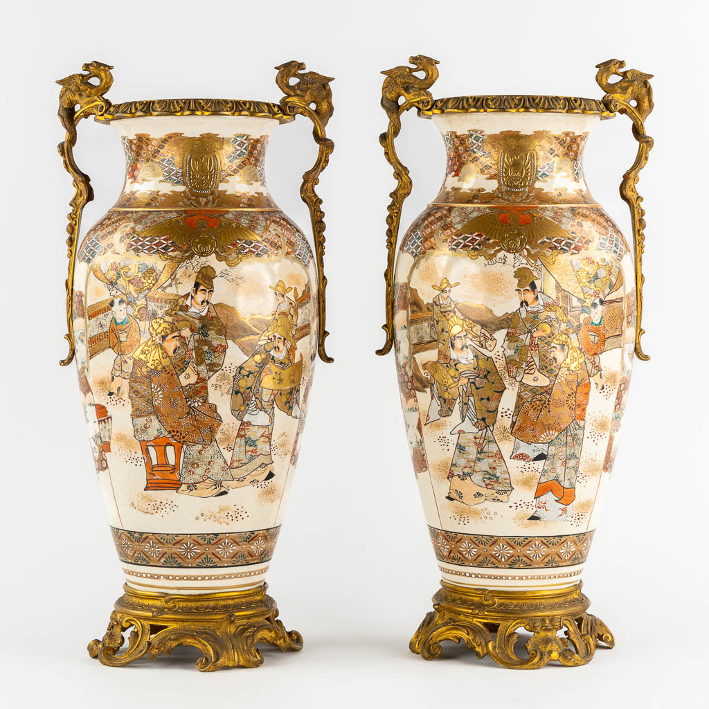 A pair of Japanese Kutani vases, mounted with bronze. Added a Chinese Canton vase. (L:24 x W:27 x H:56 cm)