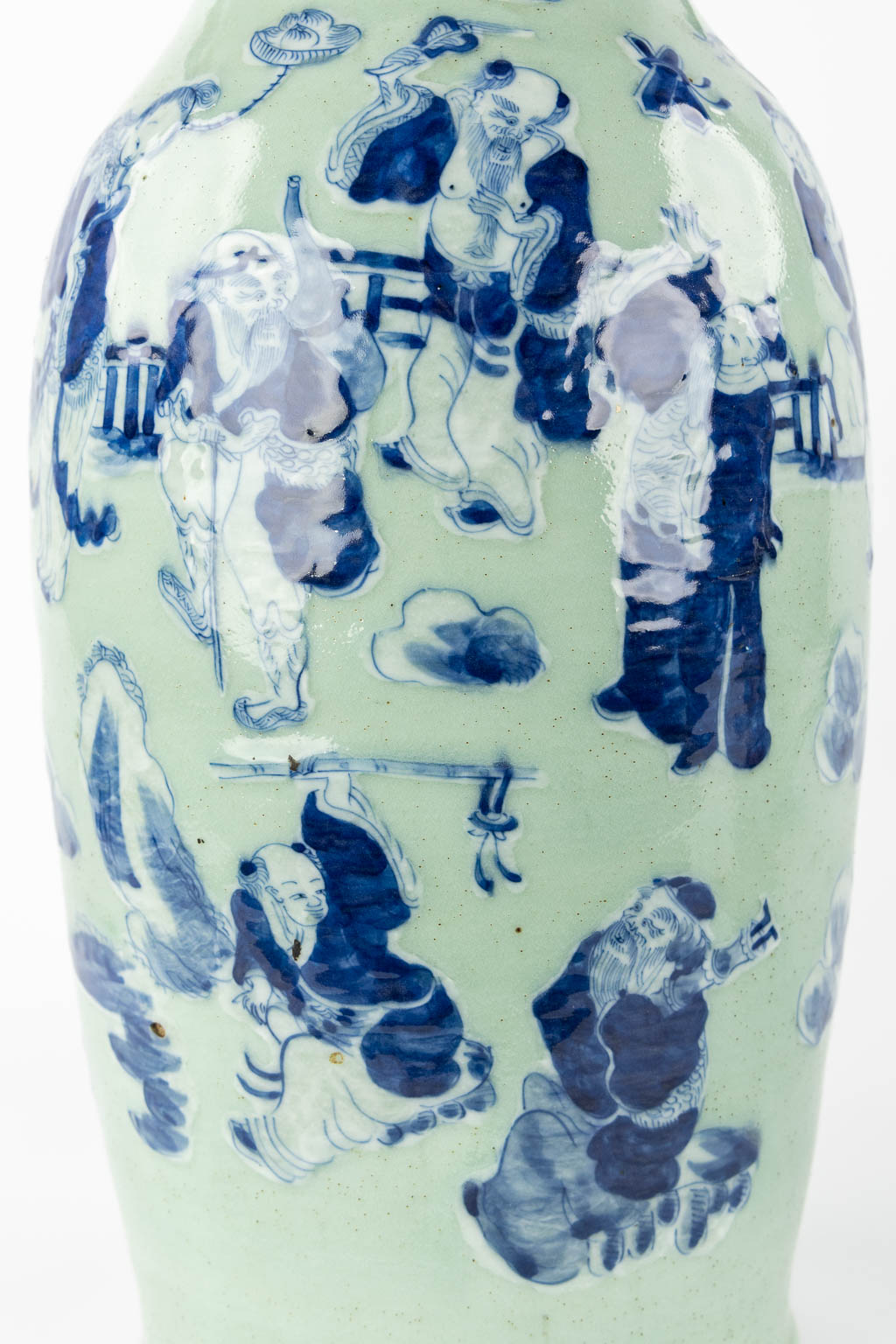 A Chinese vase blue-white decor of the Eight Immortals, added a pair of Nanking vases. (H:61 x D:23 cm)