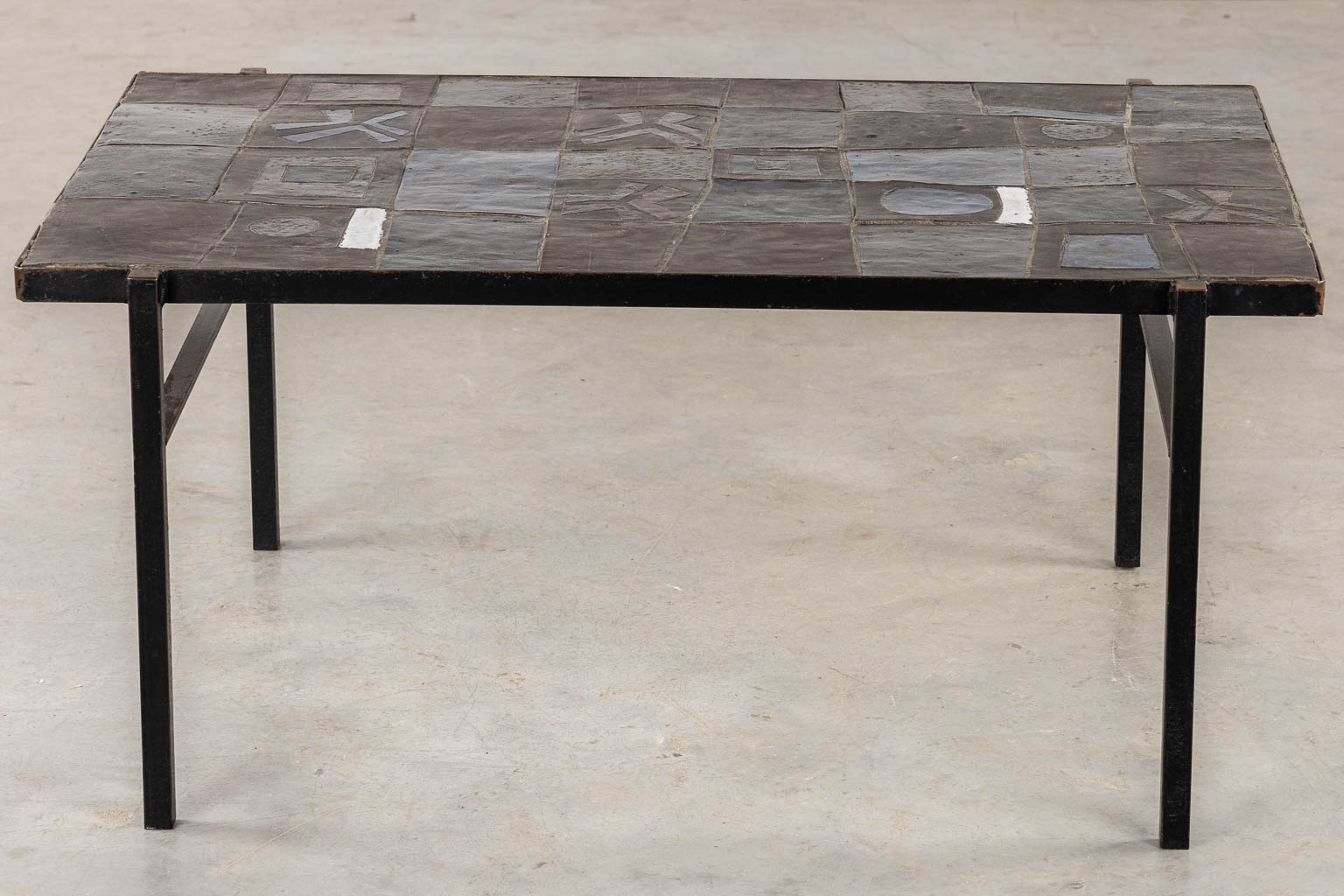 A mid-century coffee table, ceramic tiles on a metal base, circa 1970. (L:75 x W:110 x H:50 cm)