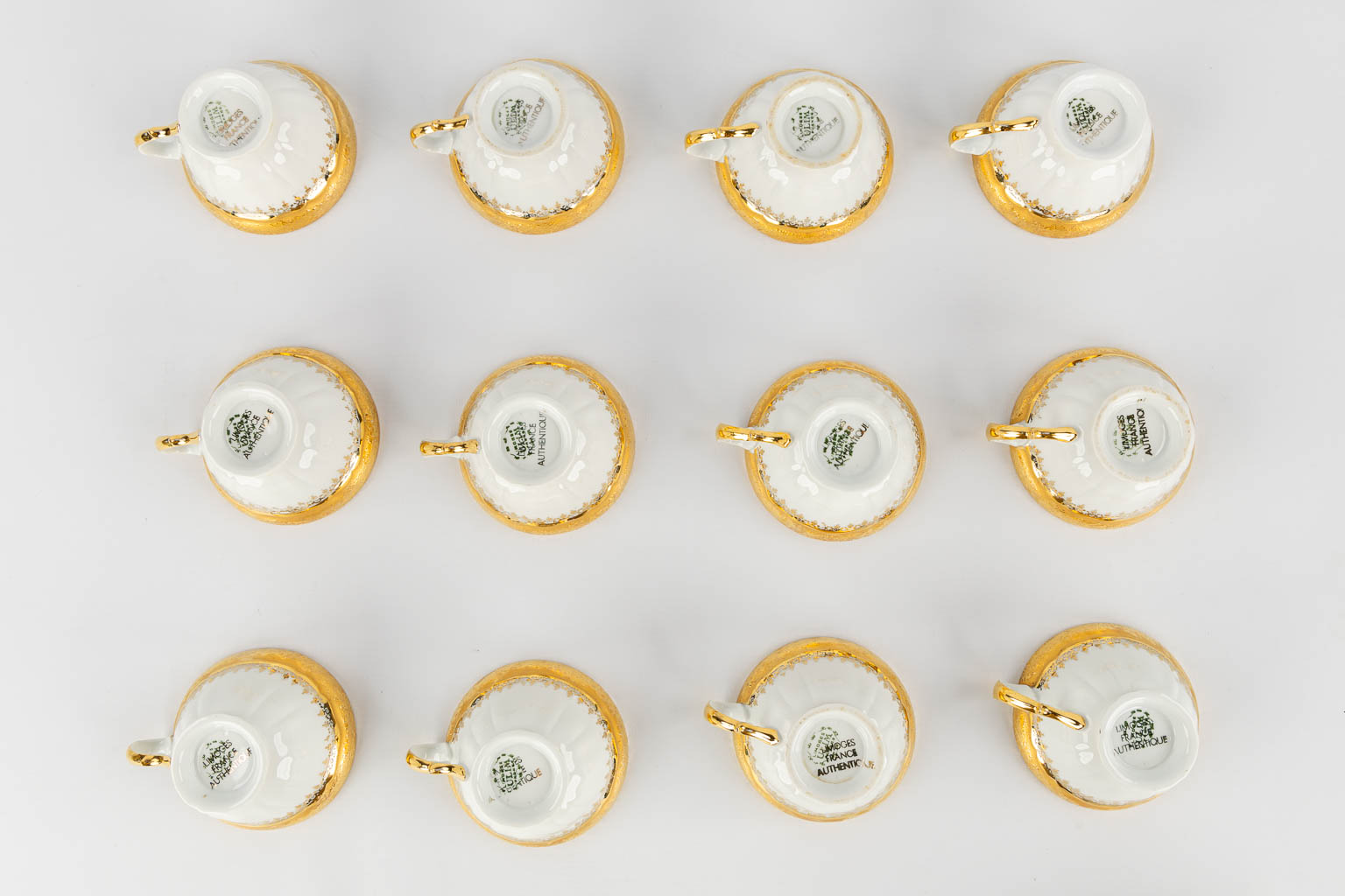 ULIM Limoges, a large dinner and coffee service, porcelain with a gilt rim. (L:26 x W:31 x H:20 cm)