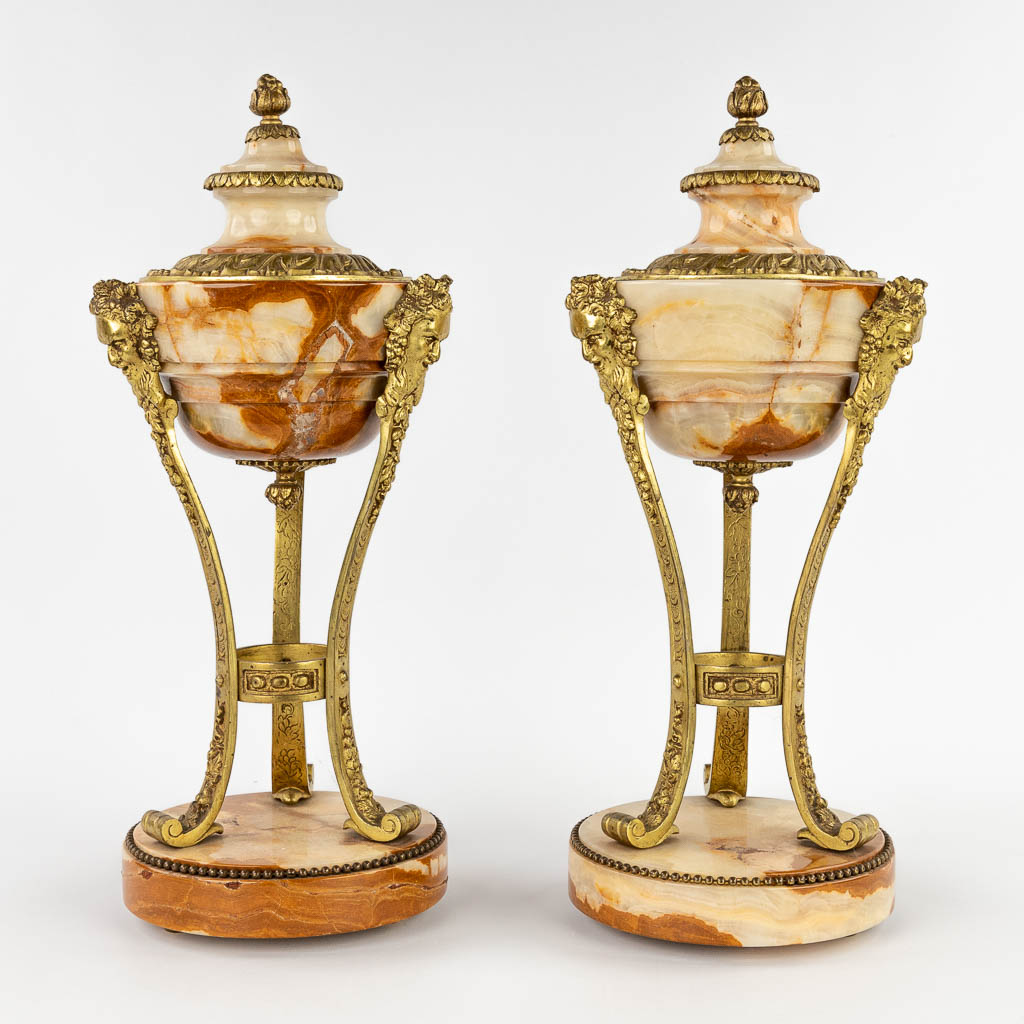 A pair of cassolettes, onyx mounted with bronze in Louis XVI style. Circa 1900. (H:45 x D:18 cm)