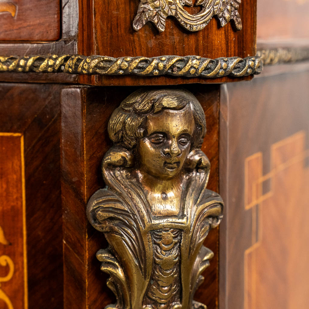 A two-door marquetry inlay cabinet, mounted with bronze and a marble. 20th C.