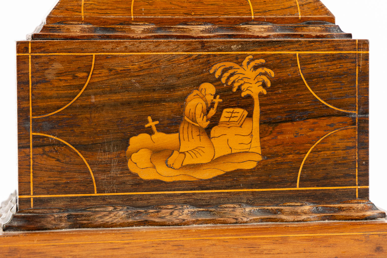 A bronze Corpus Christi mounted on a mahogany and marquetry inlay crucifix.