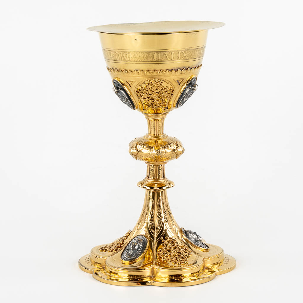 A Gothic Revival chalice with enamel plaques, cabochons. Silver Cuppa, Gilt brass, 19th C.