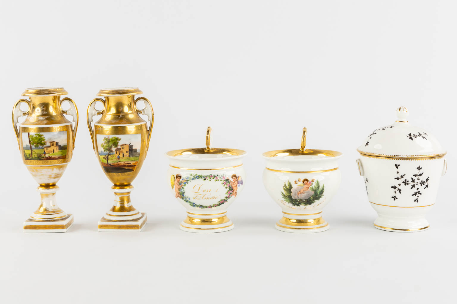 Various pieces of Vieux Bruxelles and Vieux Paris porcelain, mostly with gilt. 18th and 19th C. (H:18,5 cm)