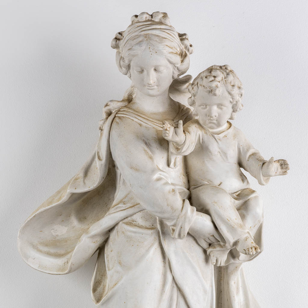 Madonna with a child, standing on a crescent moon, Baroque style. Circa 1900. (L:30 x W:42 x H:91 cm)