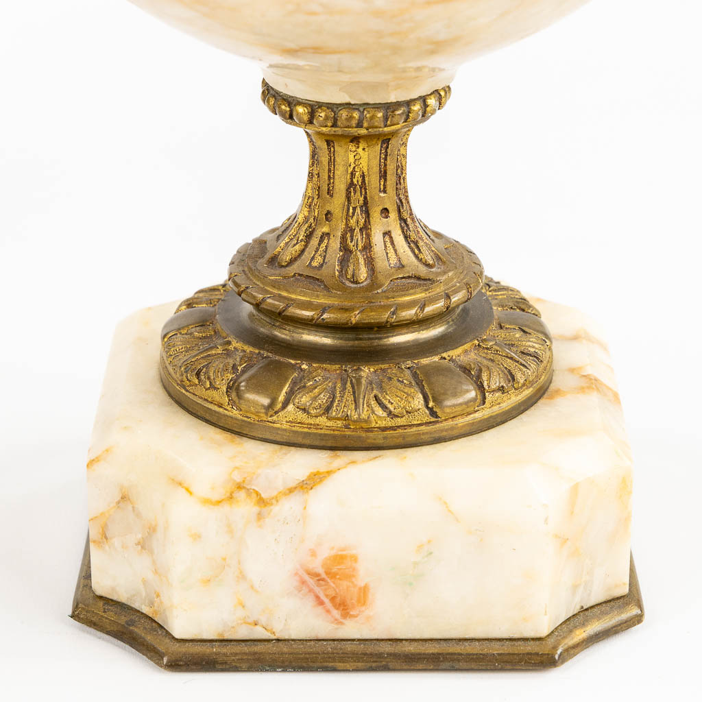 A pair of marble cassolettes, marble mounted with bronze in Louis XVI style. Ram