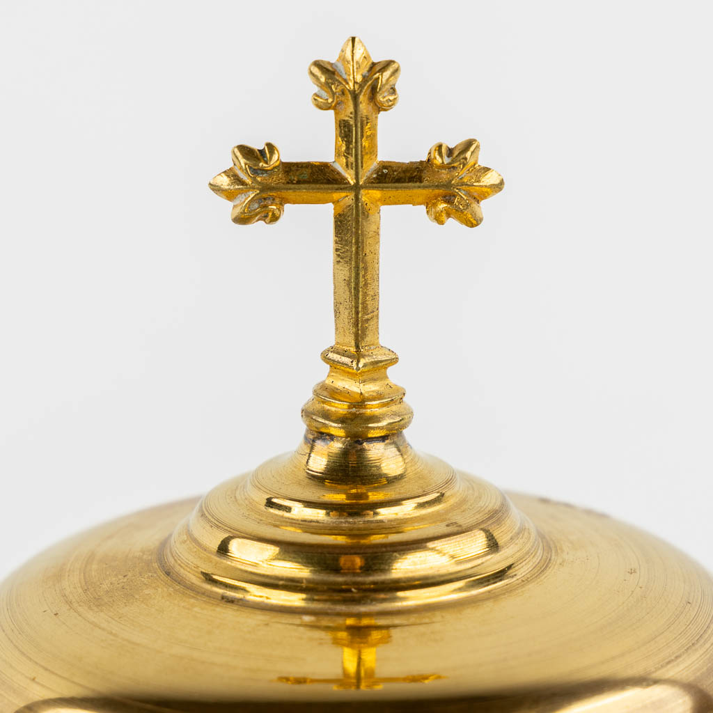 Two gold-plated Gothic Revival Ciboria and a modernist Chalice with paten. (H:30 x D:12 cm)